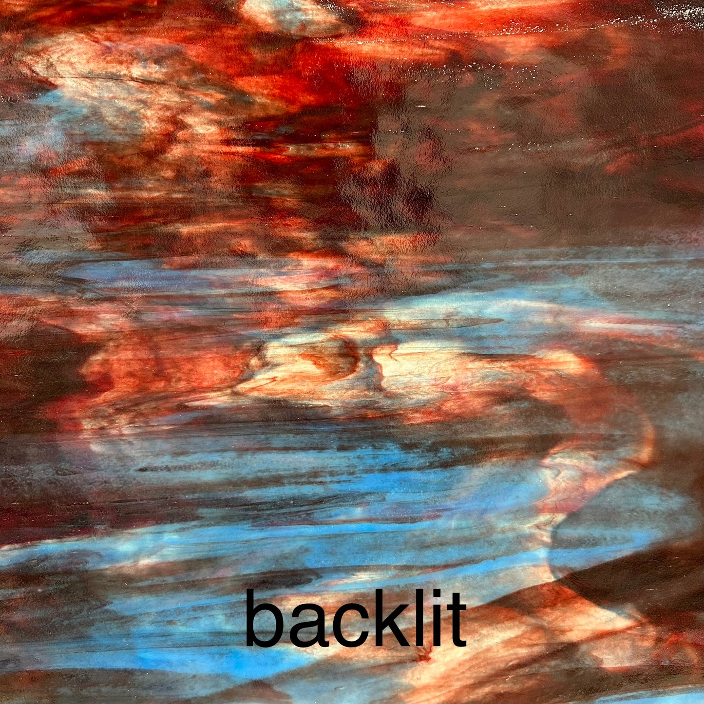 A backlit sheet of red and blue glass.