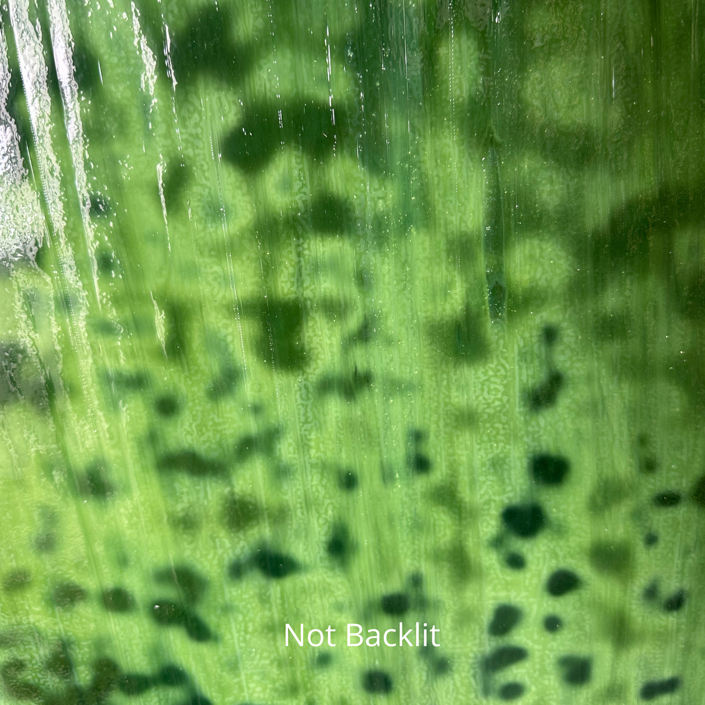 Emerald green mottled art glass.