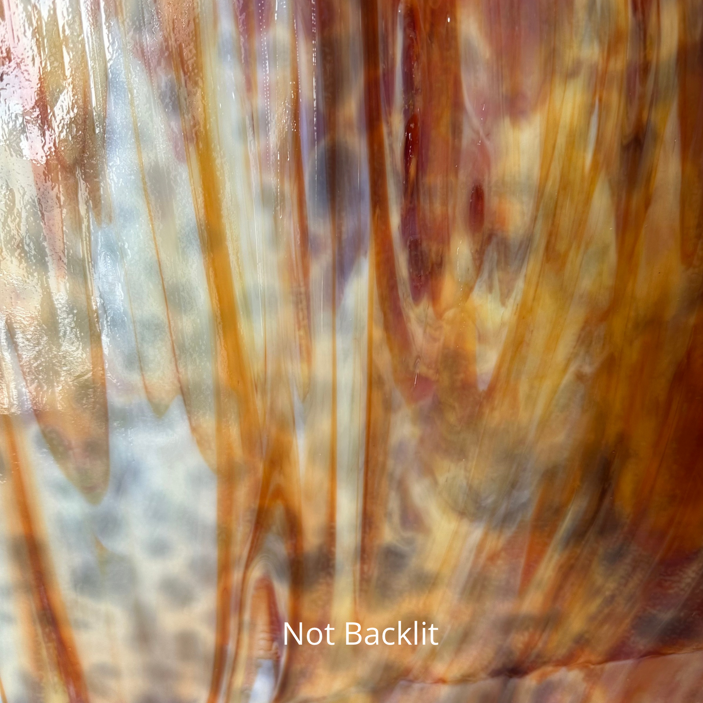 White and orange and red mottled art glass.