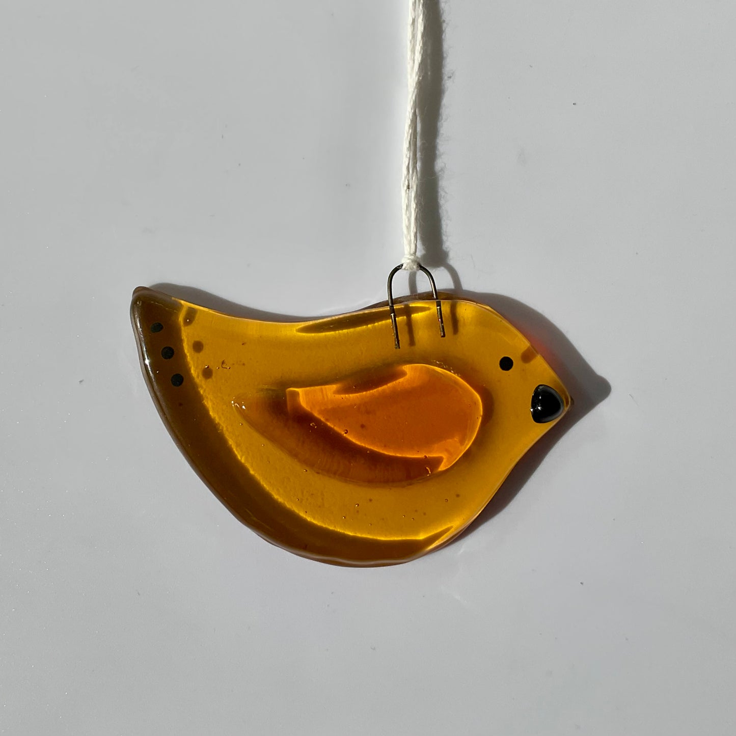 Amber fused glass bird ornament