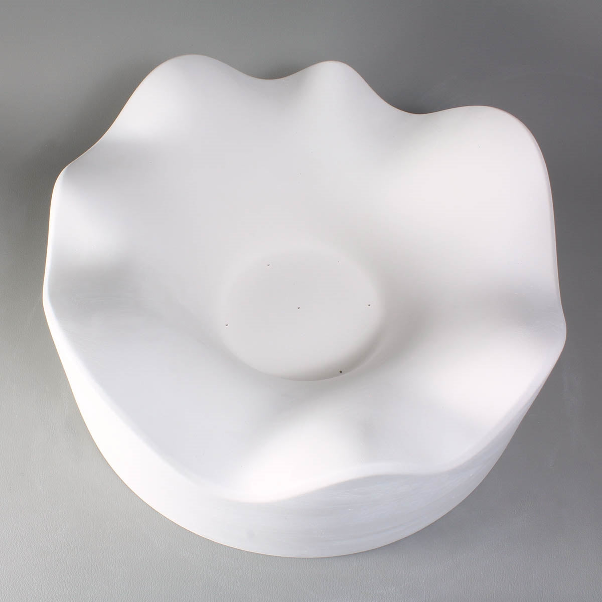 An organic shape slumping mold for fused glass.