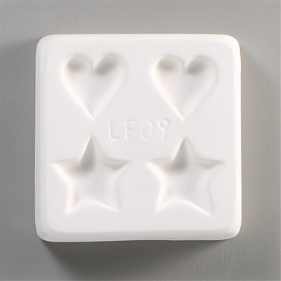 A heart and star mold for glass fusing.