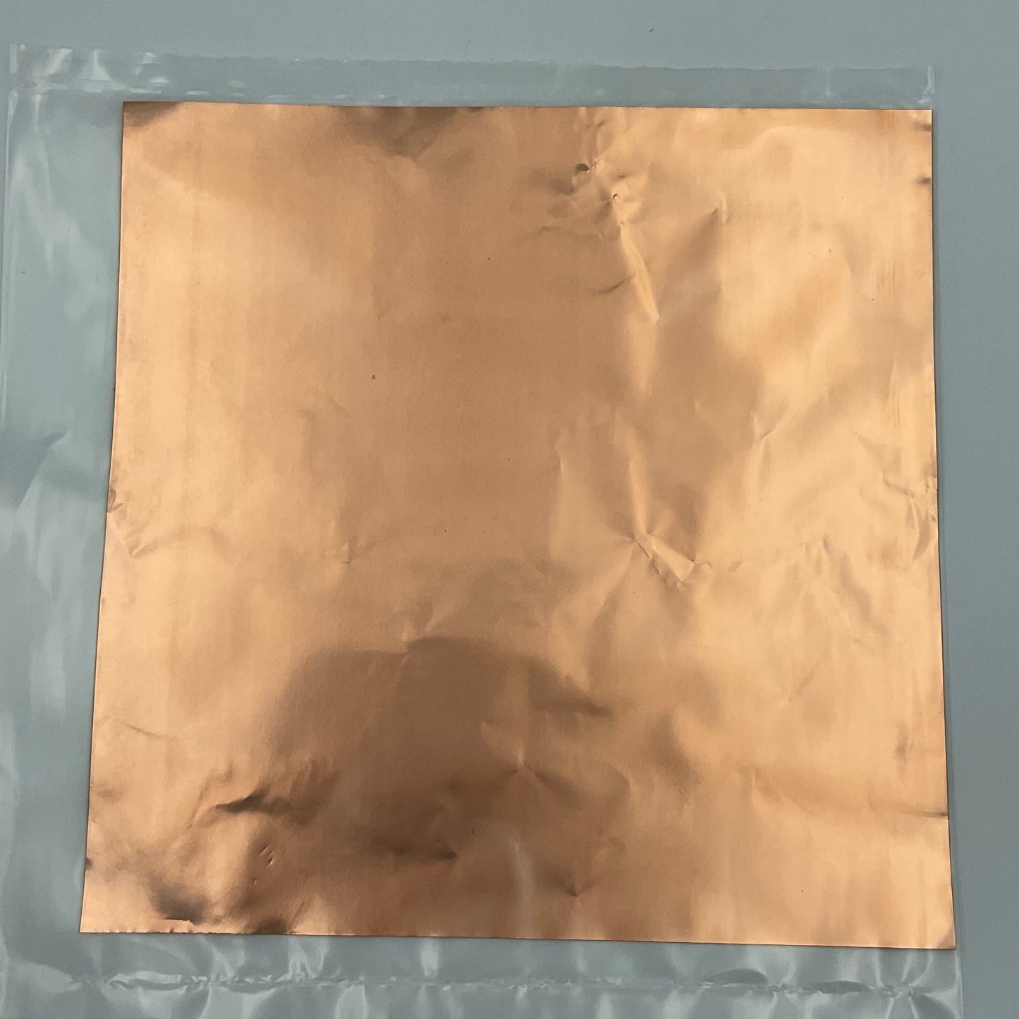 A 12 inch square sheet of copper foil for stained glass.
