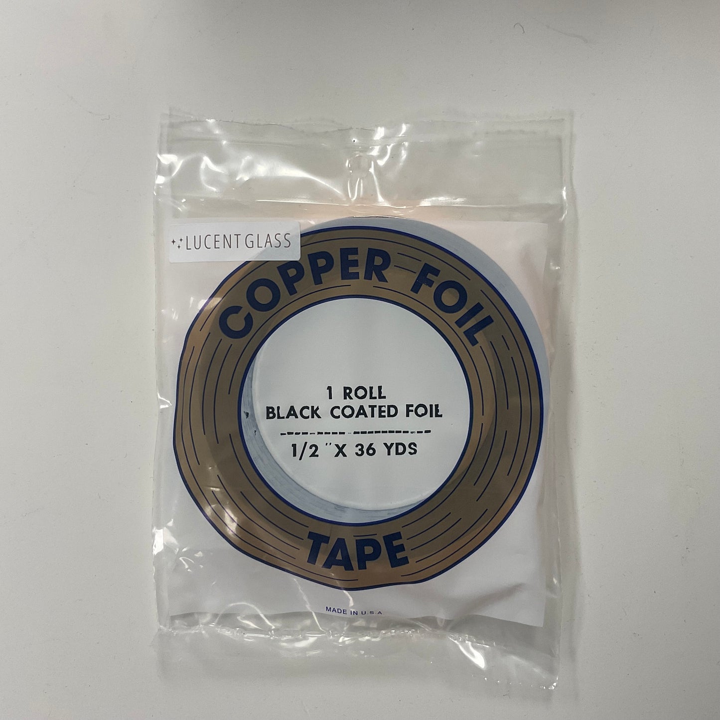 A package of 1/2" black back copper foil for stained glass.