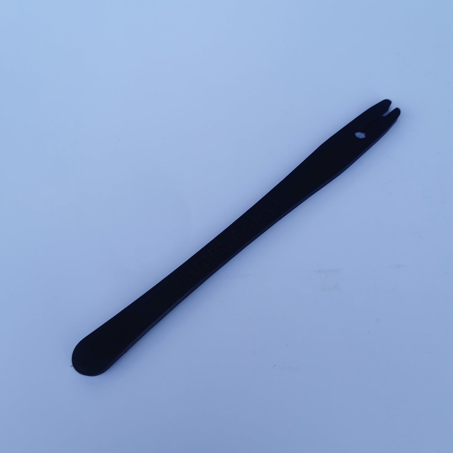 A tool for burnishing copper foil on stained glass pieces.