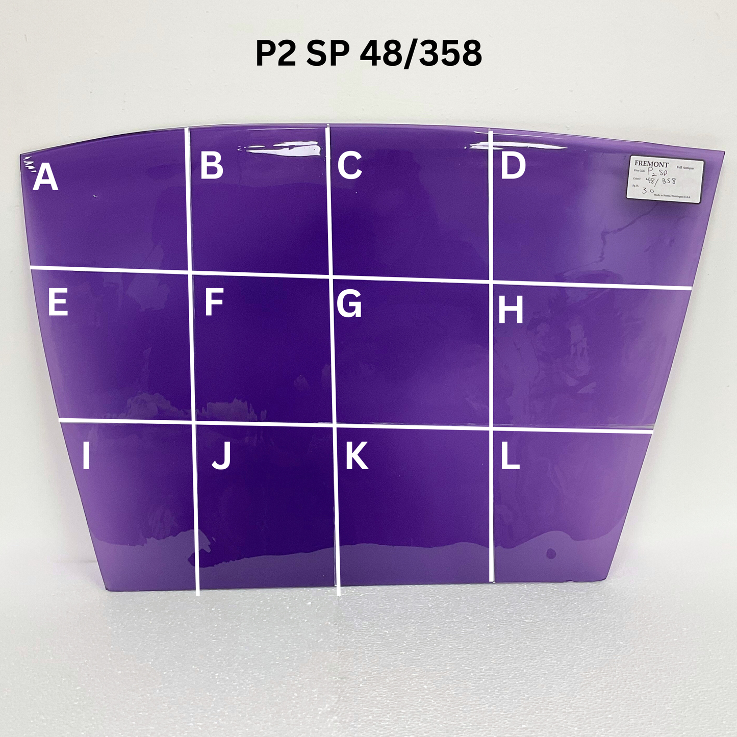 Purple sample with letter labels on a white background