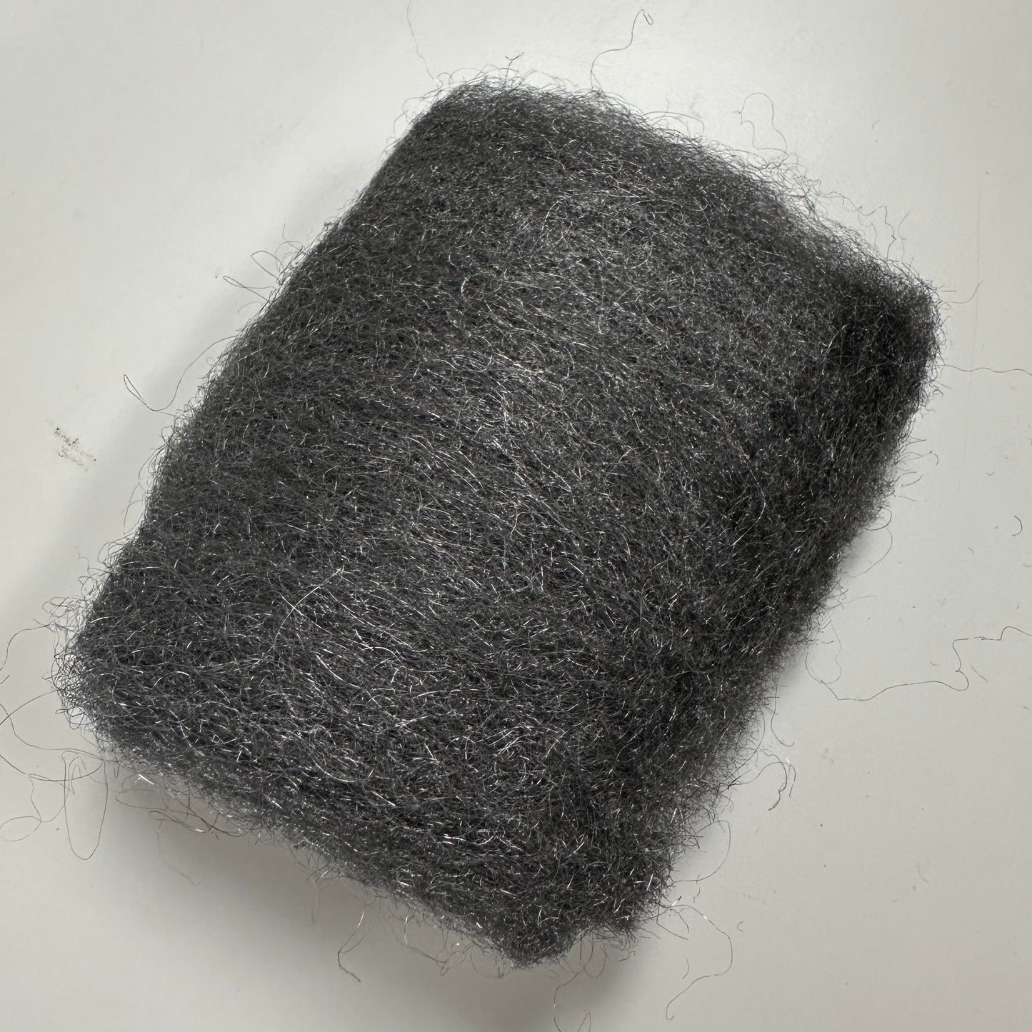 A piece of 0000 steel wool.
