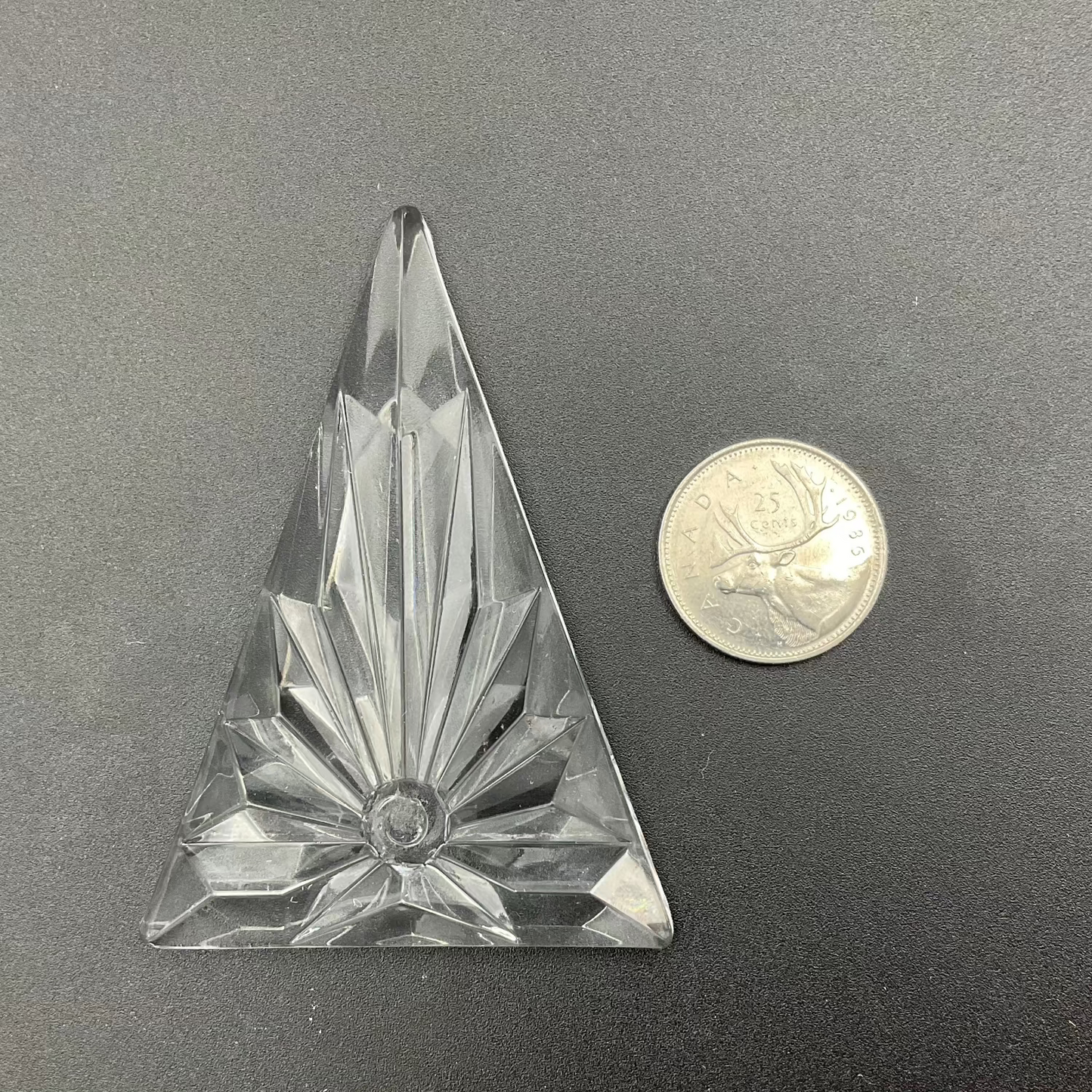 A large textured triangle glass jewel.