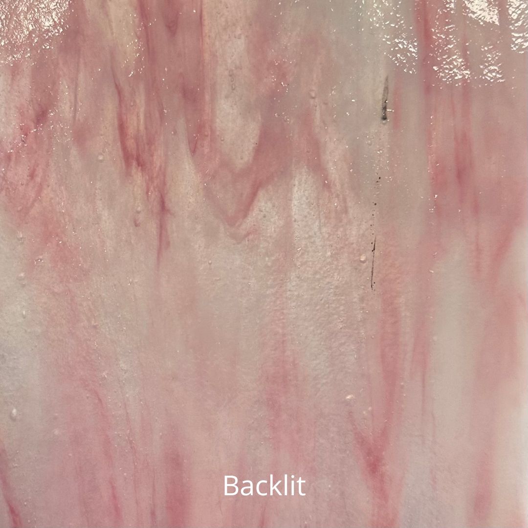 A backlit photo of pink and white glass.