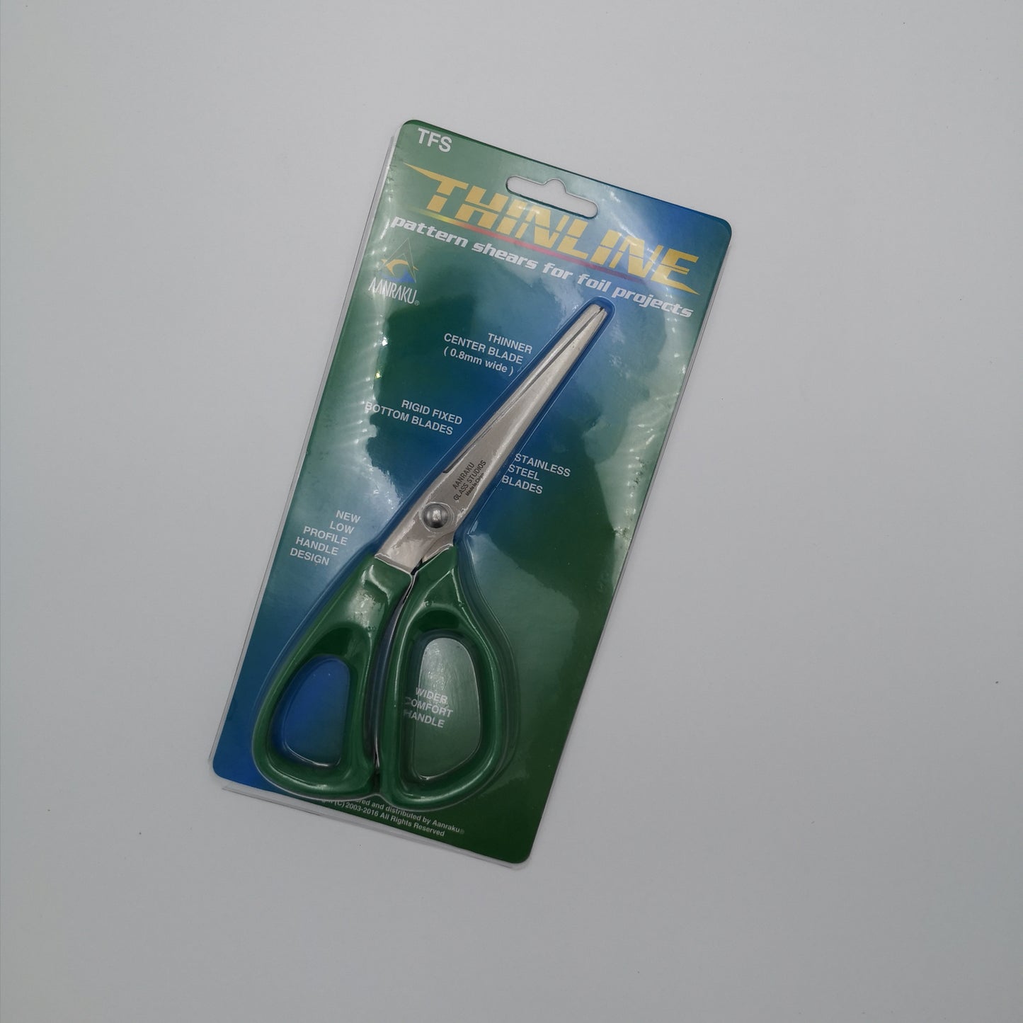 A pair of shears made for foil stained glass work.