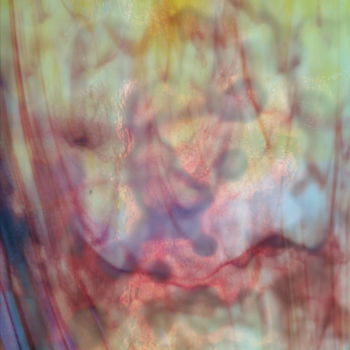Red and yellow on white art glass.