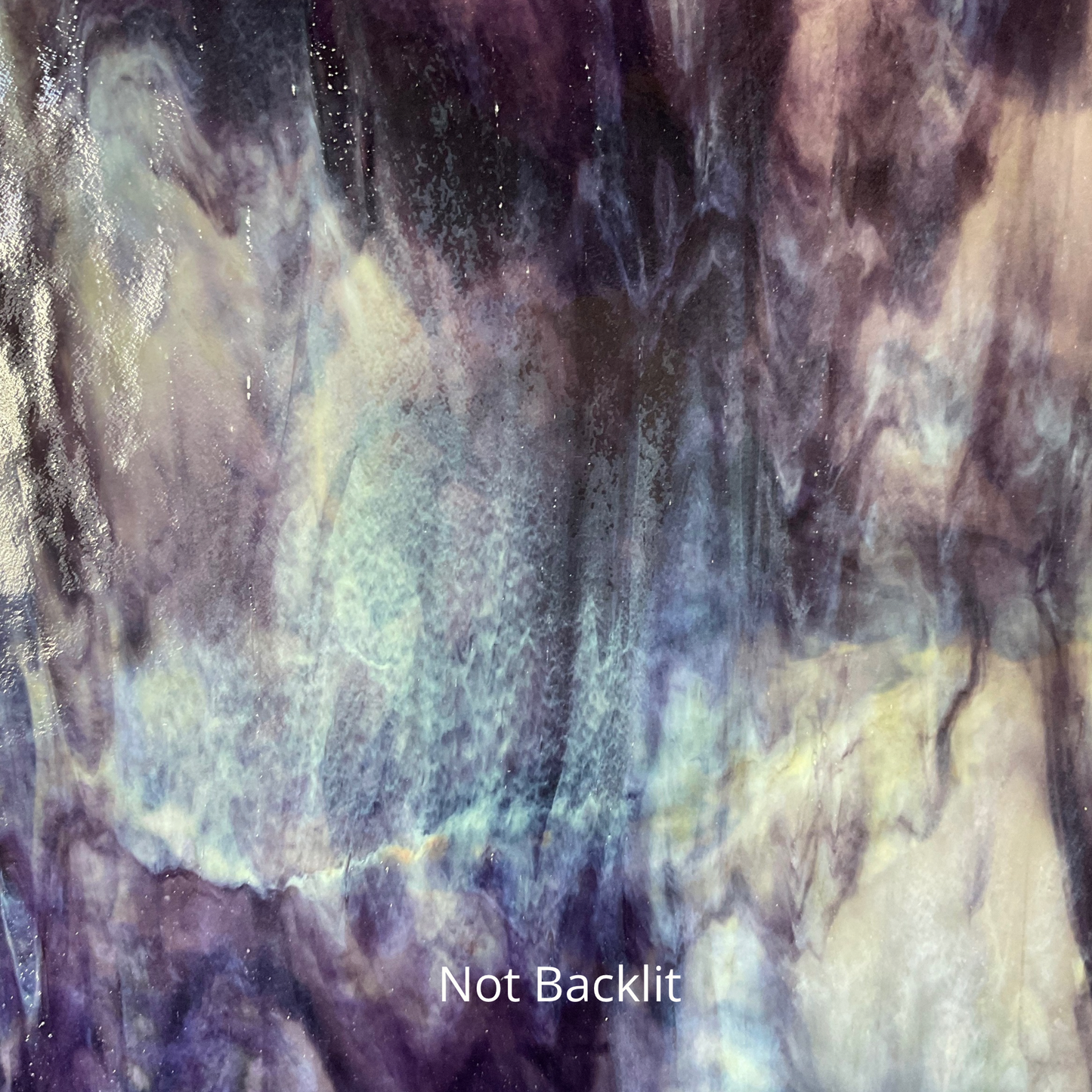 A front lit photo of purple and yellow sheet glass.