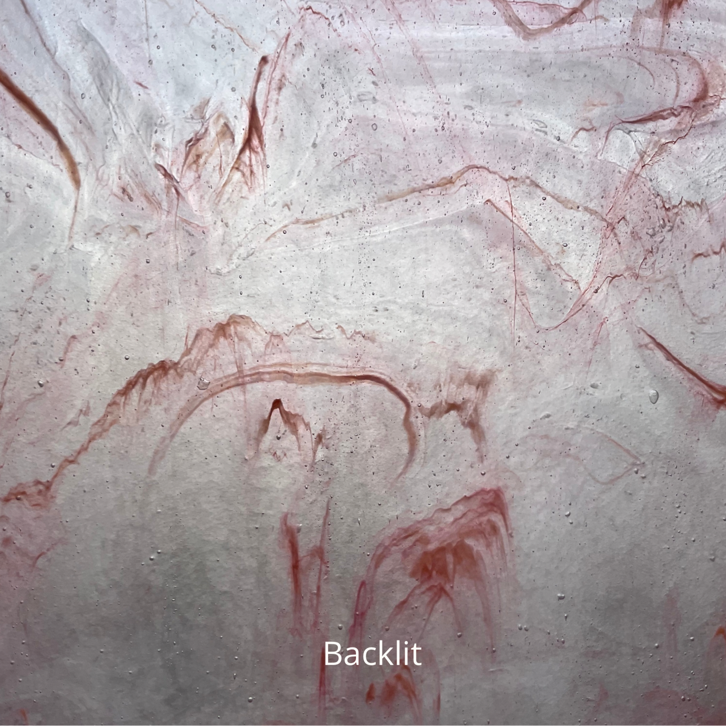 A backlit photo of pink and clear glass.