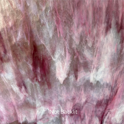 A photo of pink and white streaky glass.