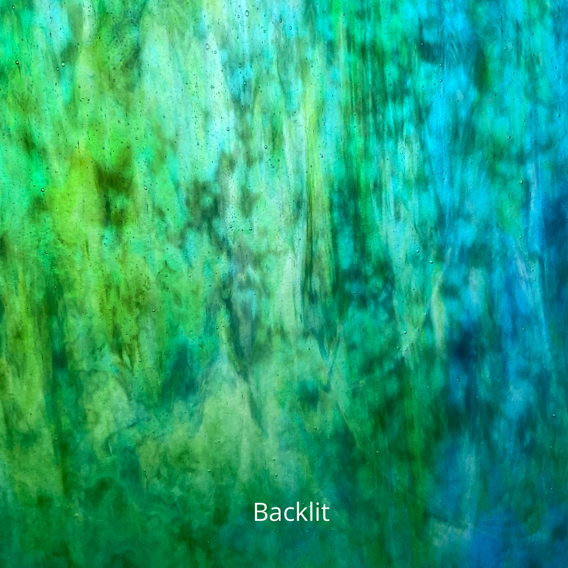 Backlit photo of a blue and green piece of art glass.