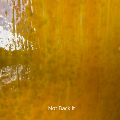Mottled amber art glass.