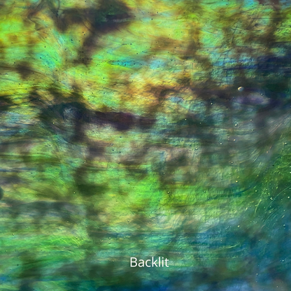 Blue and green iridized art glass, backlit.
