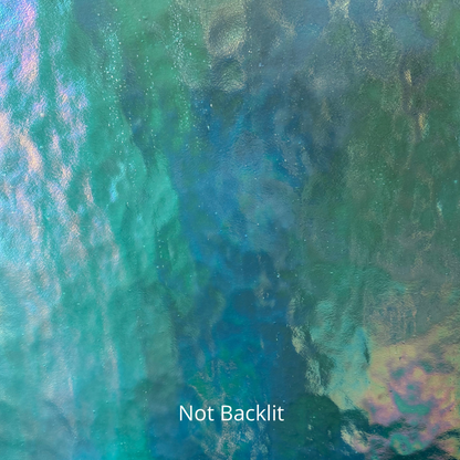 A non-backlit photo of blue iridescent stained glass.