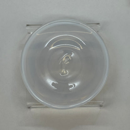 An alabaster white hand blown glass rondel for stained glass work.