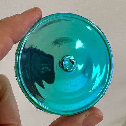 An iridescent blue green rondel for stained glass.