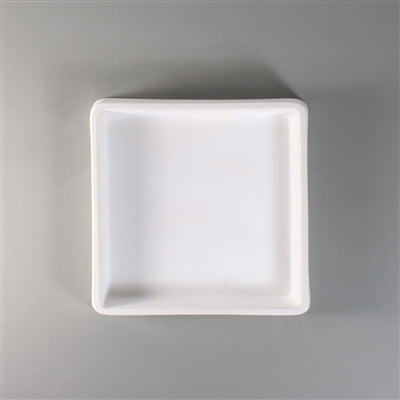 A square dam mold for fused glass.