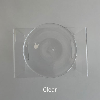 A clear hand blown glass rondel for stained glass work.