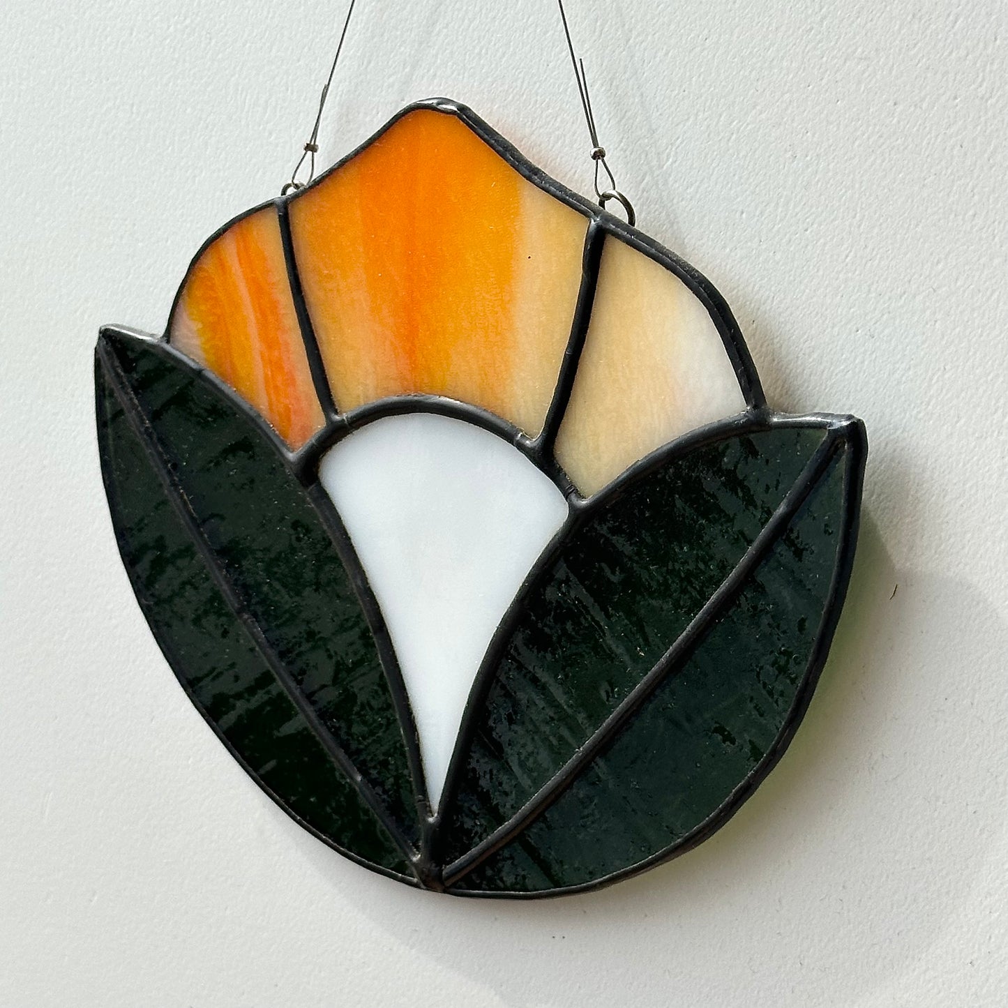Stained glass art of a flower.