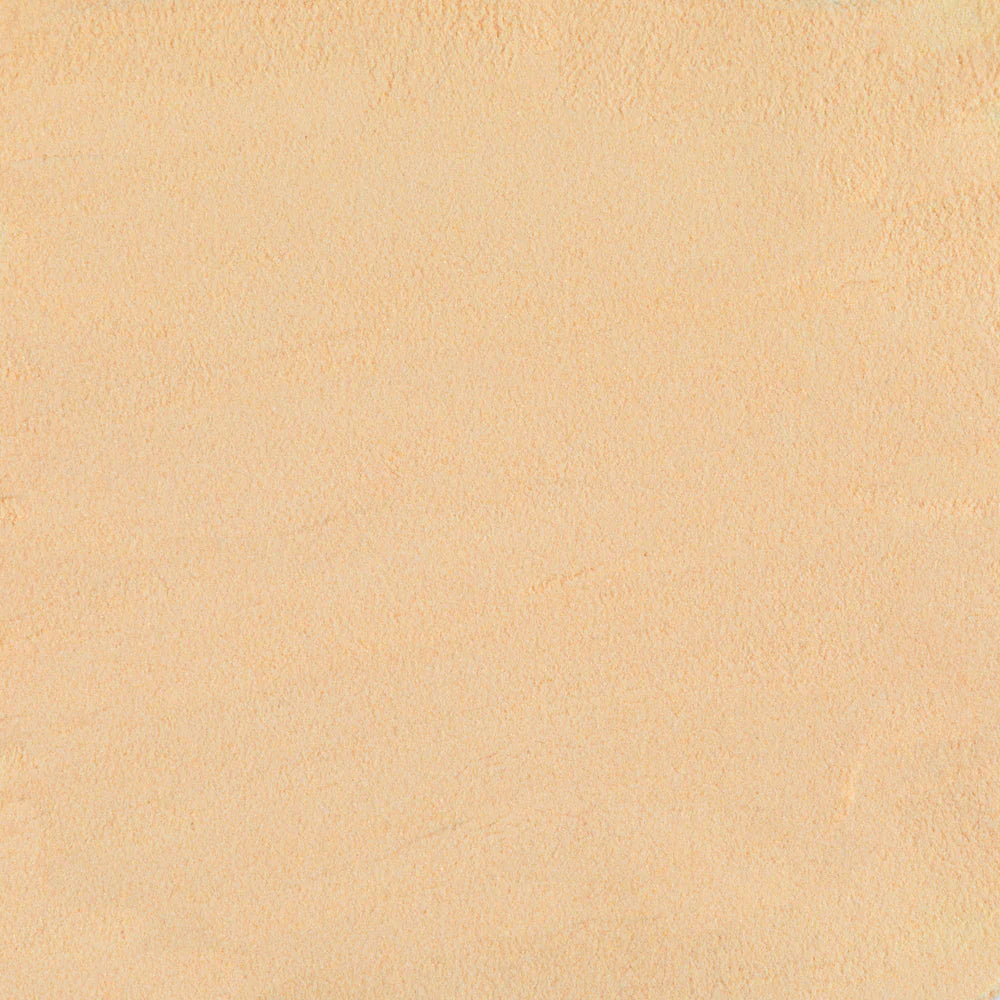 A beige textured ceramic tile frit.