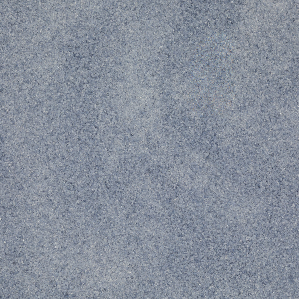 A close-up texture shot of a mottled slate blue fabric or material surface.