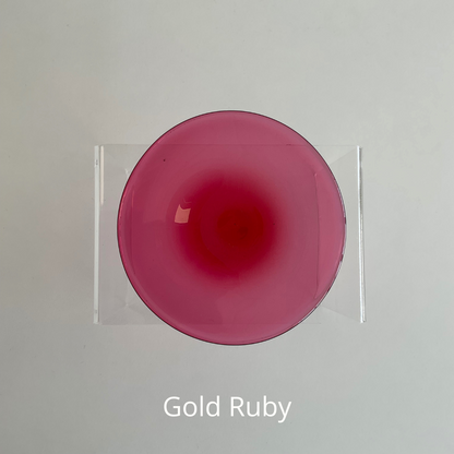 A pink ruby hand blown glass rondel for stained glass work.