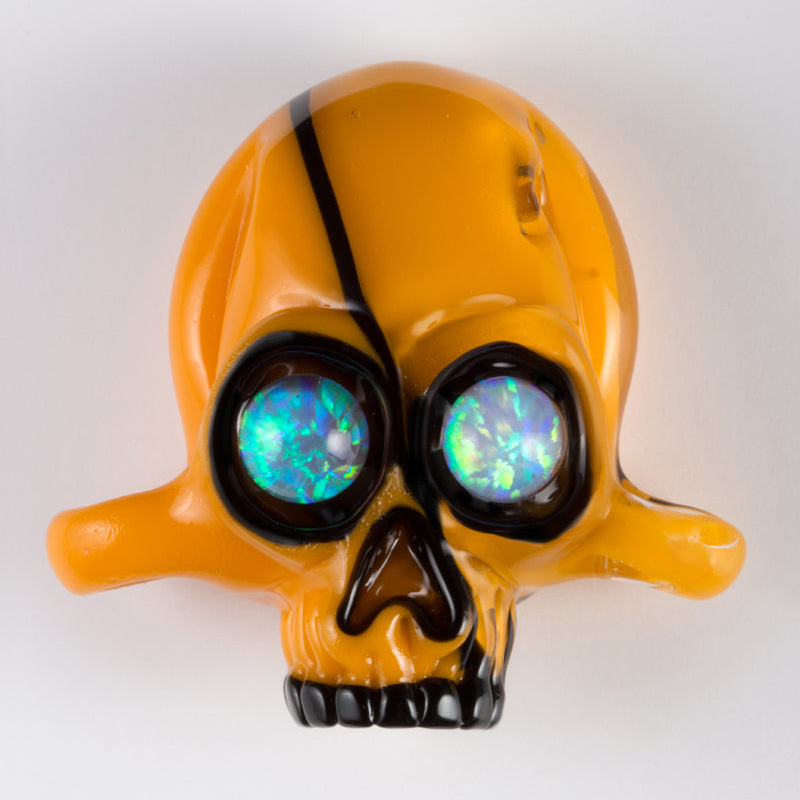 Skull-shaped object with glowing eyes on a white background