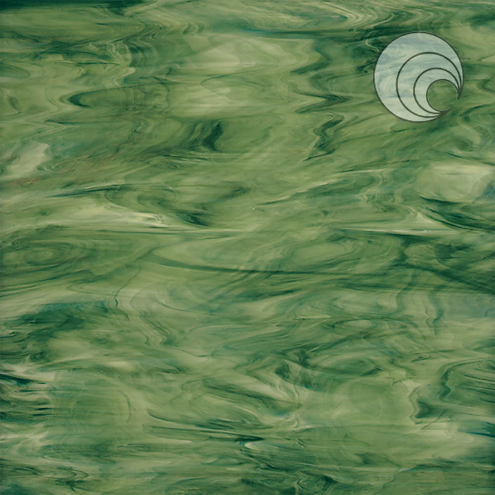 A sheet of forest green opal smooth fusible art glass with a swirl pattern.
