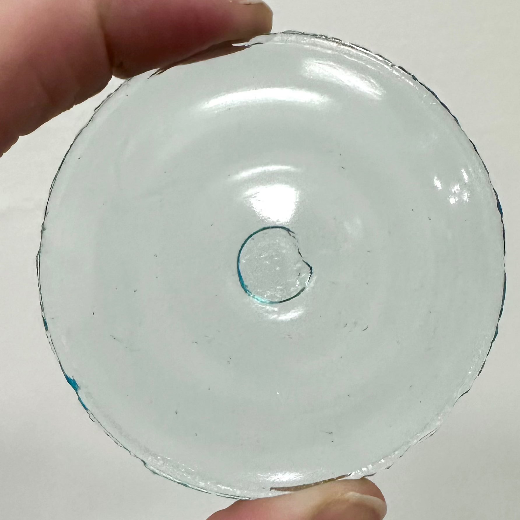 A light blue glass rondel.
