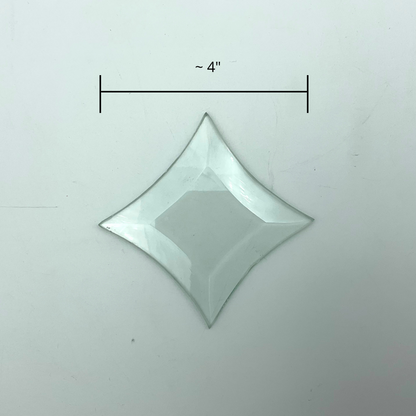 A small glass star bevel with measurements showing 4" wide.