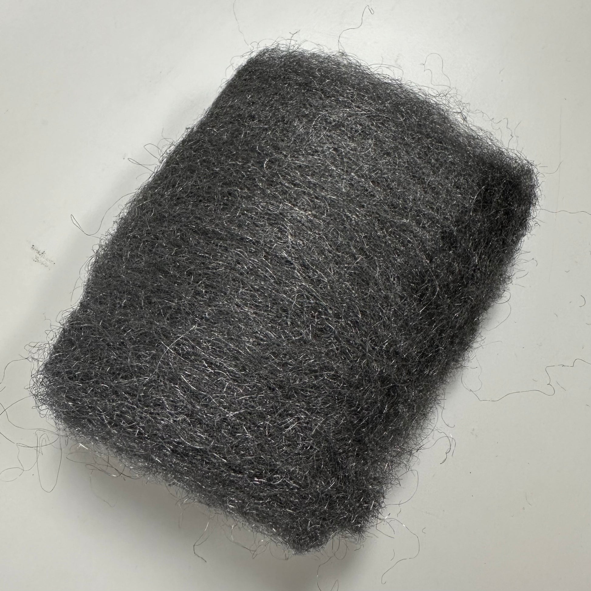 A piece of 0000 steel wool.