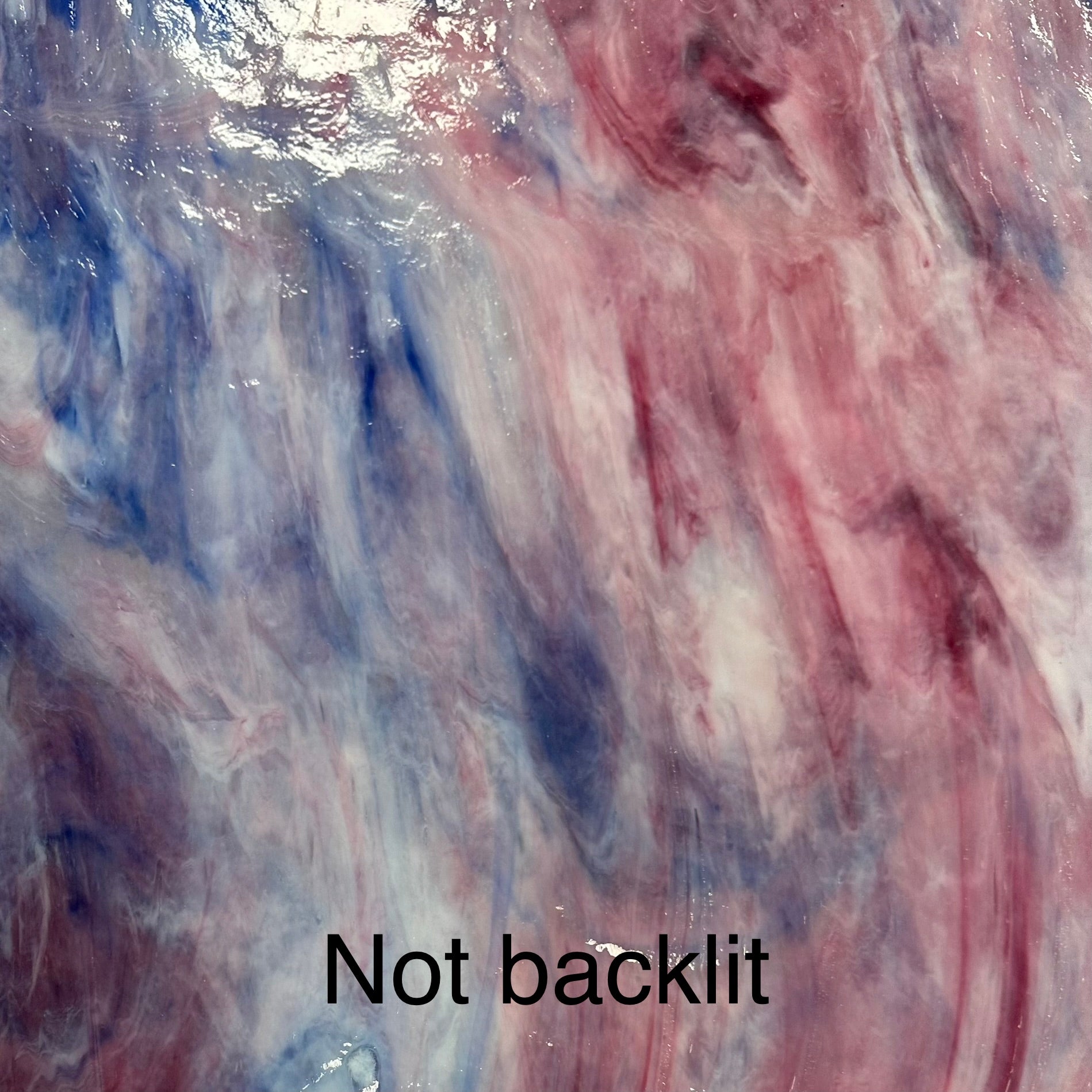 A blue white and pink sheet of glass for stained glass.