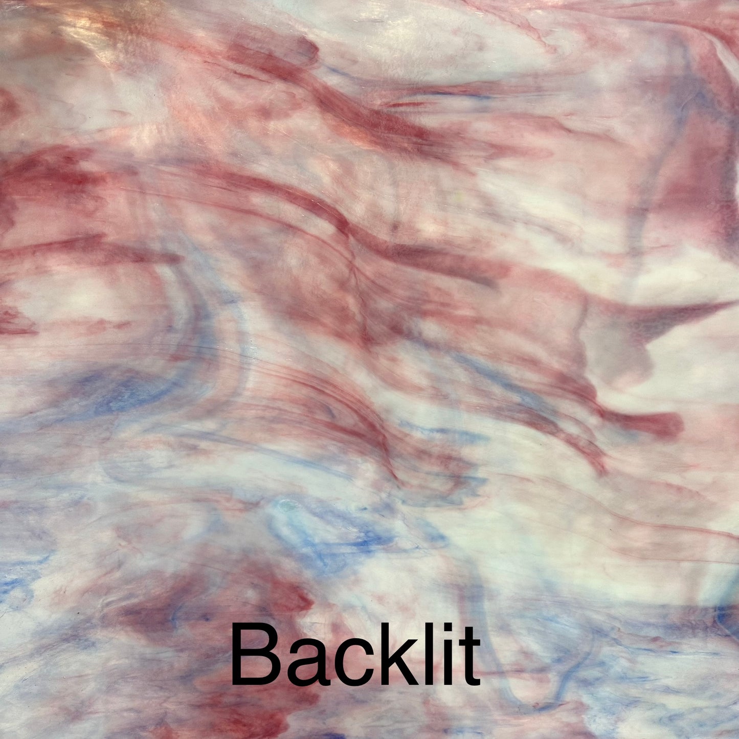 A white, pink and blue piece of sheet glass.