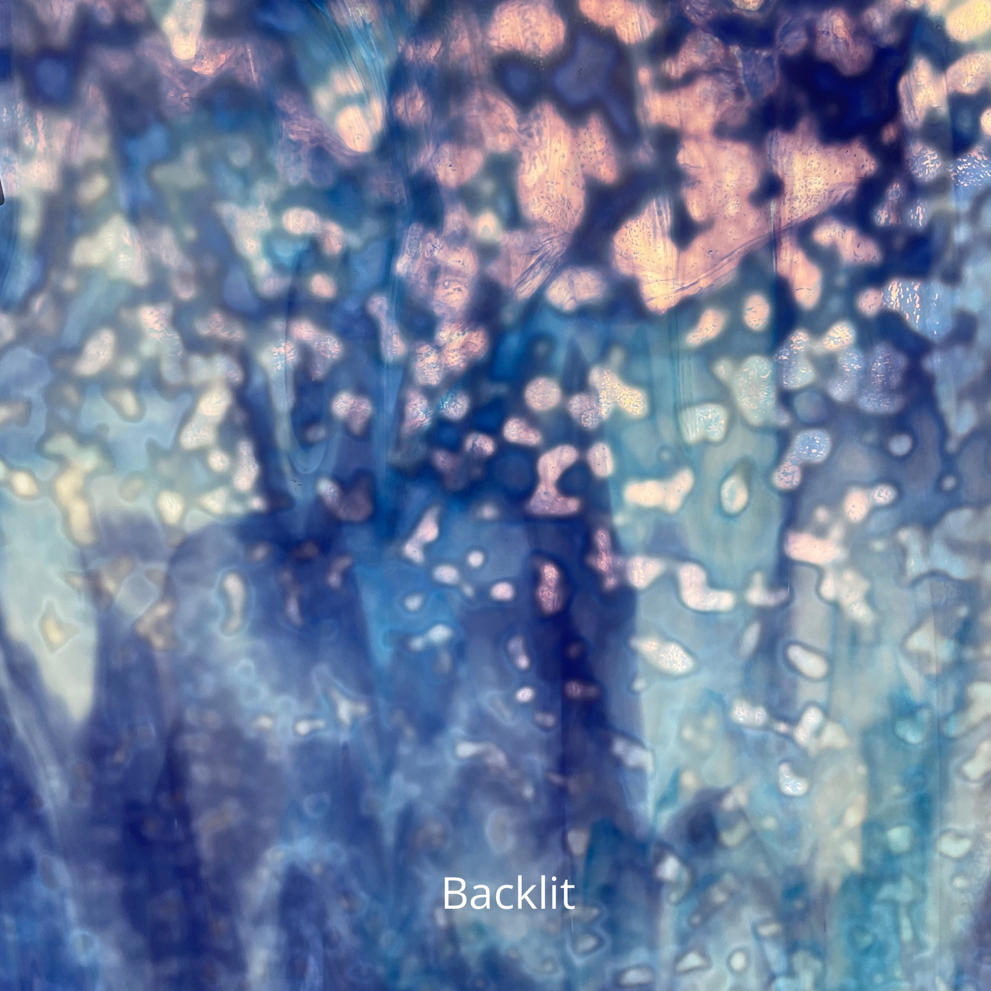 Blue and white mottled art glass, backlit.