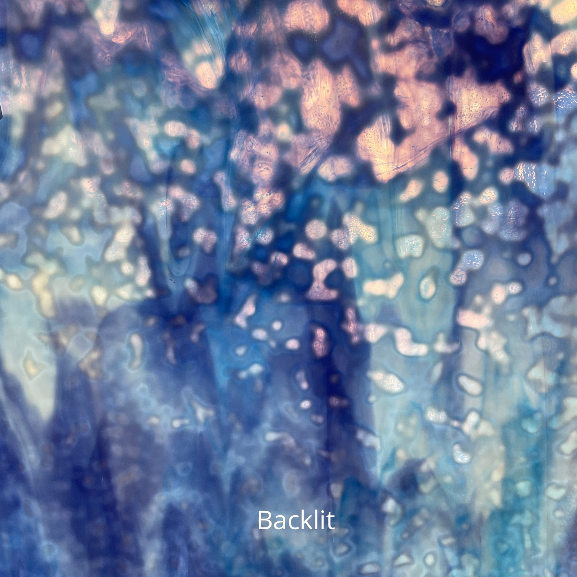 Blue and white mottled art glass, backlit.