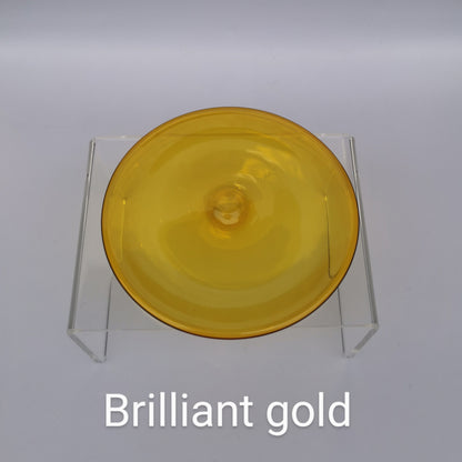 A gold-coloured hand blown glass rondel for stained glass work.