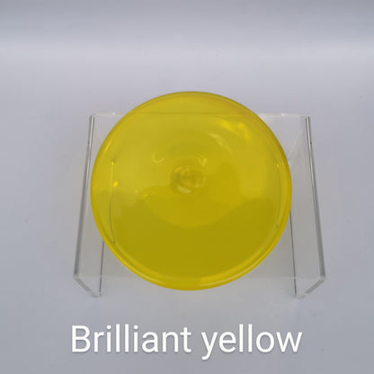 A bright yellow hand blown glass rondel for stained glass work.