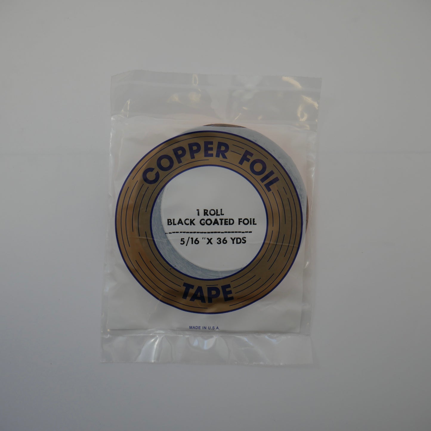 A package of 5/16" black back copper foil for stained glass.