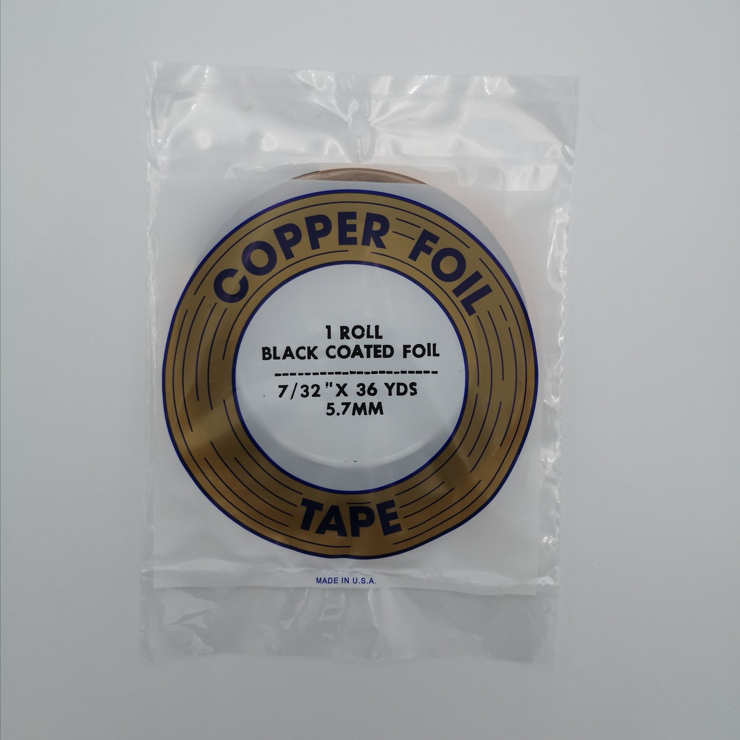 A package of 7/32" black back copper foil for stained glass.
