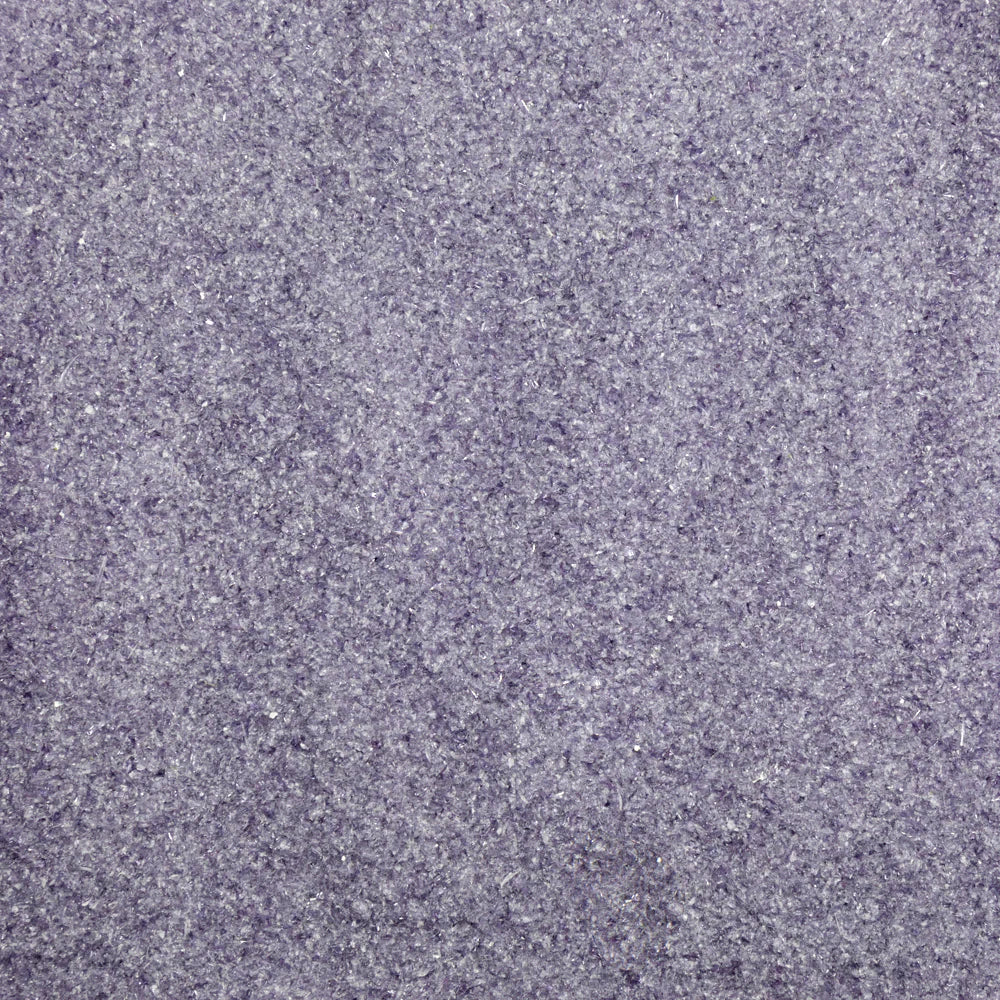 Close-up view of a purple transparent frit, typically used in glass crafting.