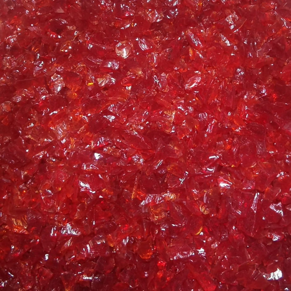 Close-up view of a cherry red colored frit crushed glass, typically used in glassmaking.