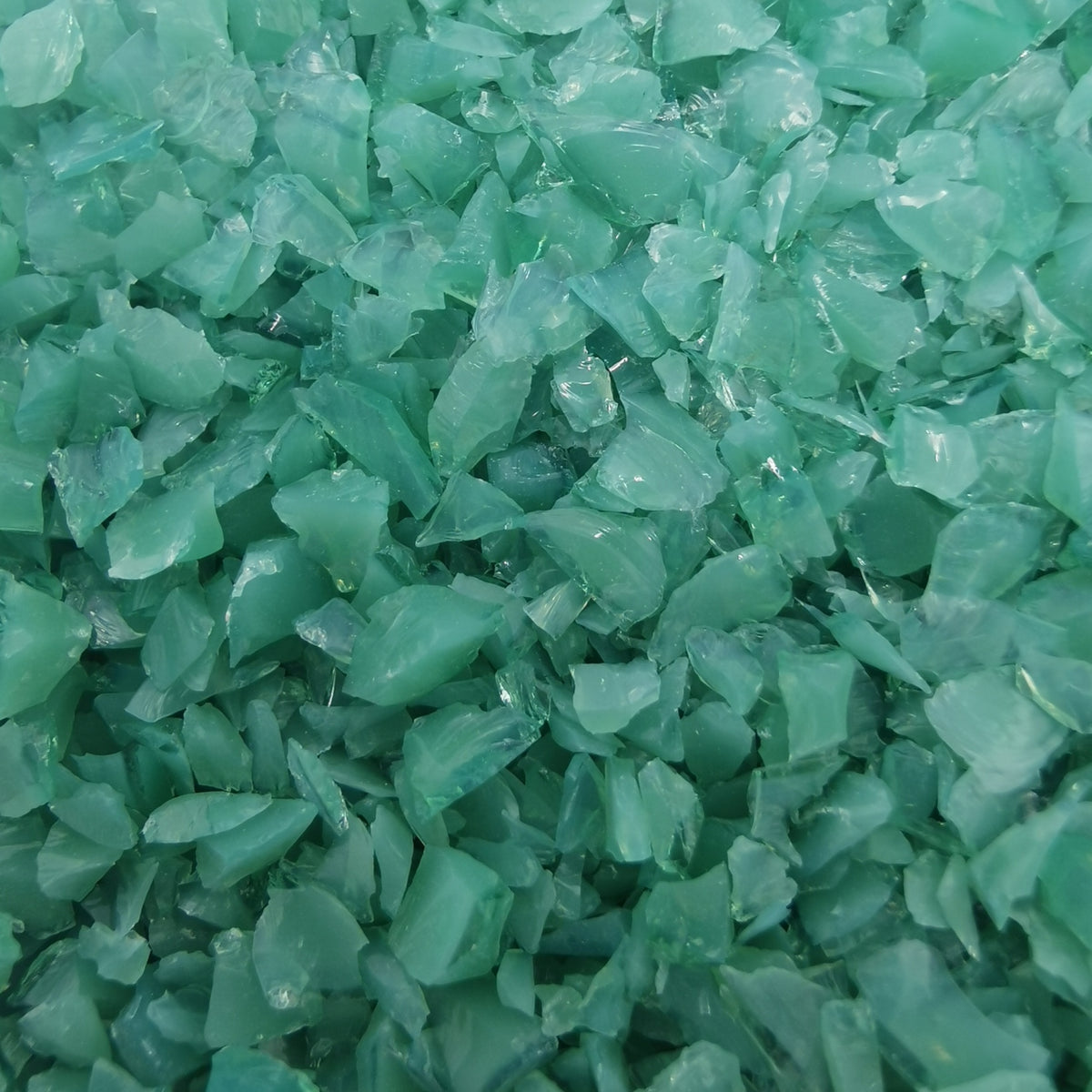 Close-up view of a textured green surface with a blurred edge.