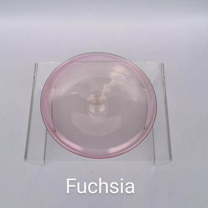 A fuchsia pink hand blown glass rondel for stained glass work.