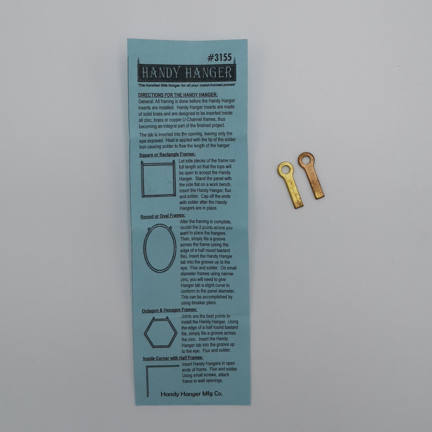 A pair of Handy Hangers for hanging stained glass panels.
