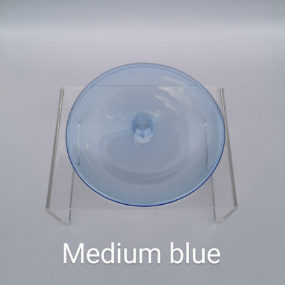 A medium blue hand blown glass rondel for stained glass work.