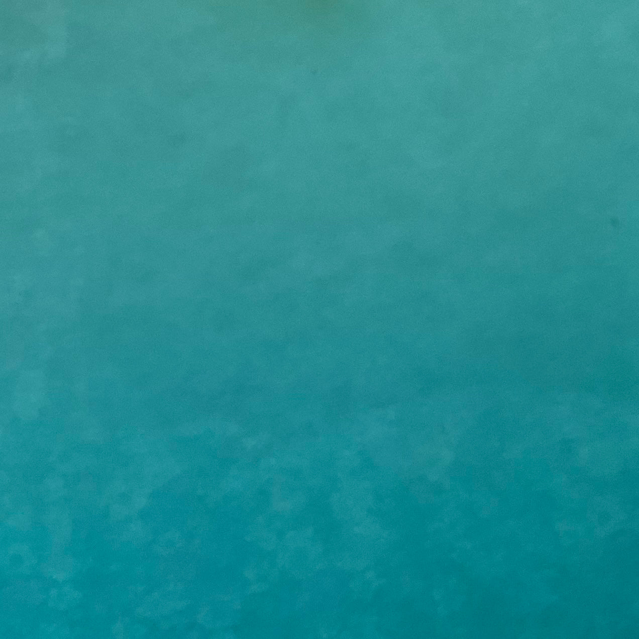 A sheet of Caribbean blue smooth fusible system 96 art glass.